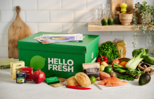 An unopened hellofresh box resting on a kitchen counter.
